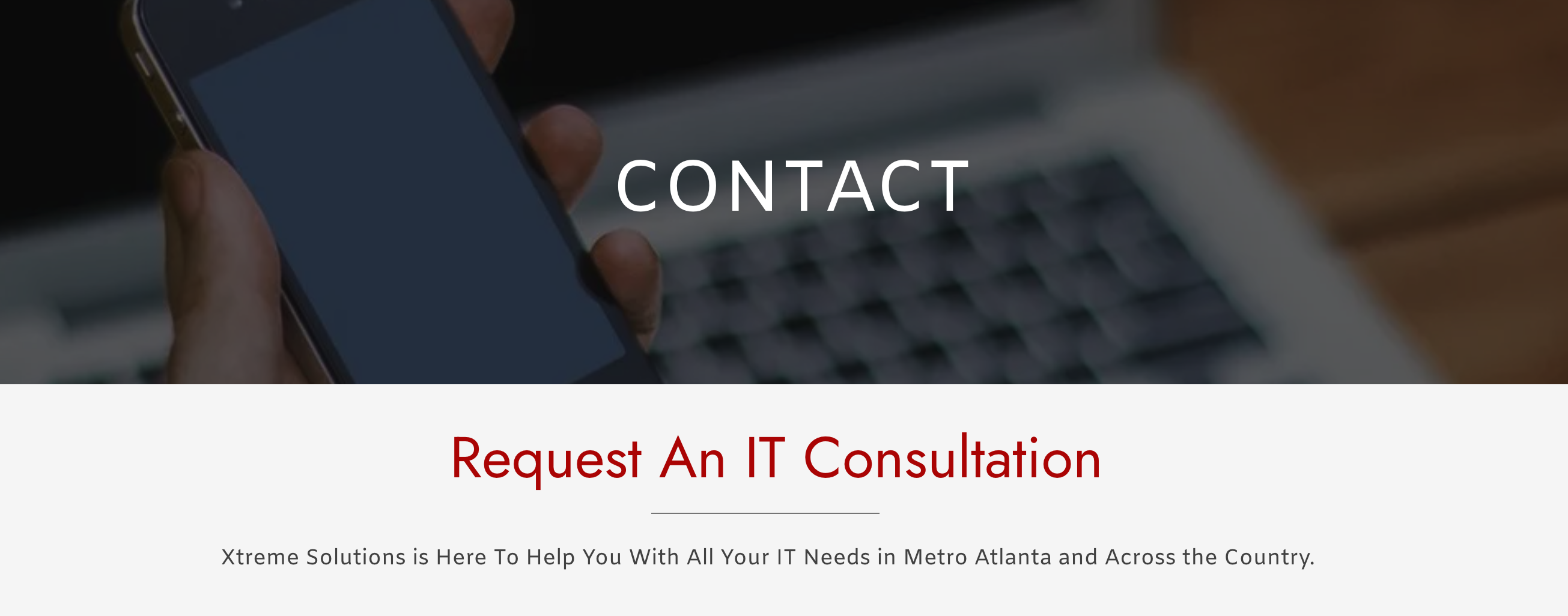 Close-up of a hand holding a smartphone with a blurred laptop keyboard in the background. Large text says 'Contact'. Below, headline reads 'Request An IT Consultation' and subtext says 'Xtreme Solutions is here to help you with all your IT needs in Metro Atlanta and across the country.'